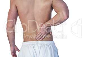 Midsection of man suffering from back pain
