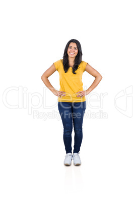 Smiling woman with hands on hips