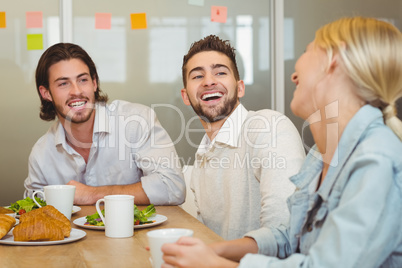 Business people laughing during brunch