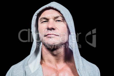 Portrait of confident man in grey hood