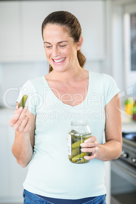 Happy woman looking at pickle