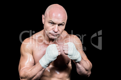 Portrait of confident man with fighting stance