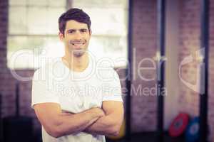 Portrait of smiling muscular man looking at camera