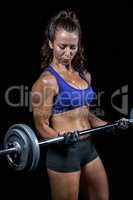 Fit female bodybuilder lifting crossfit