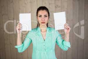 Portrait of woman holding papers