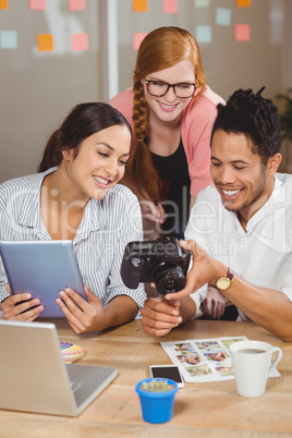 Happy business people with camera