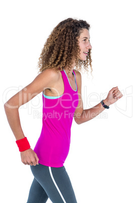 Side view of young woman jogging