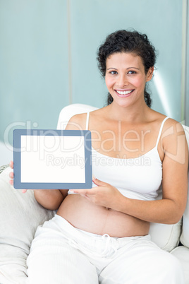 Portrait of woman with blank tablet screen