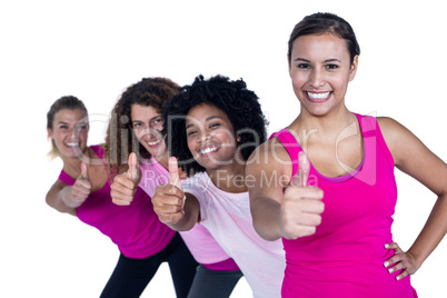 Portrait of cheerful women with thumbs up