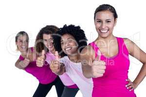 Portrait of cheerful women with thumbs up