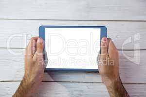 Cropped image of person holding tablet