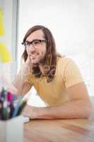 Hipster wearing eye glasses working at desk