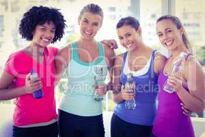 Portrait of beautiful women holding water bottle