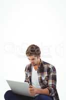 Hipster working on laptop