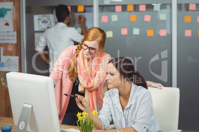 Serious businesswomen using computer