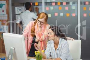 Serious businesswomen using computer