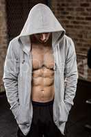 Muscular man wearing hood