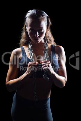 Portrait of athlete in sportswear with chain