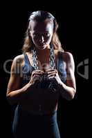 Portrait of athlete in sportswear with chain