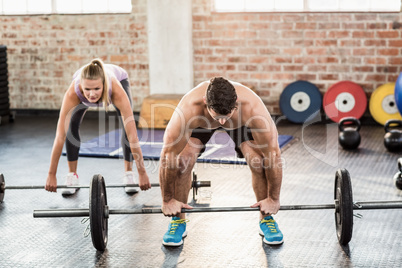 Two fit people working out at crossfit session