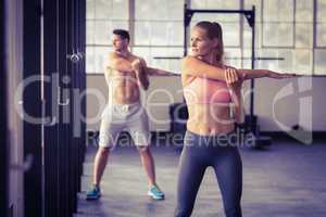 two fit people doing fitness