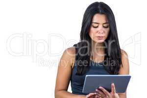 Concerned woman using her tablet