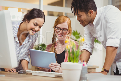 Business people looking at digital table