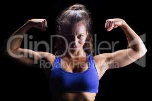 Portrait of confident bodybuilder flexing muscles