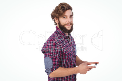 Portrait of confident hipster using smartphone