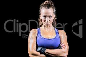 Portrait of sporty woman with arms crossed