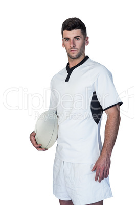 Portrait of a focused rugby player holding ball Portrait of a focused rugby player holding ball