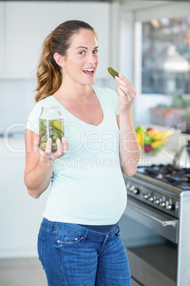 Portrait of happy woman with pickle