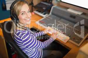 Happy radio host wearing headphones