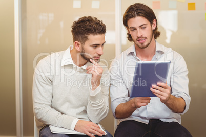 Businessman showing digital tablet