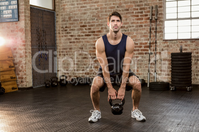 Man lifting kettlebell