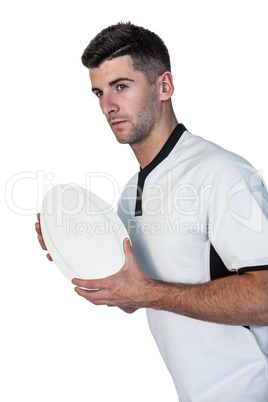 Rugby player posing with the ball