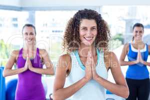 Cheerful women in fitness studio smiling