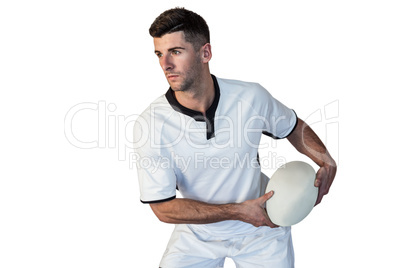 Rugby player focusing while holding ball