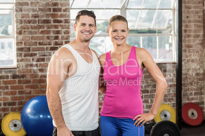 Crossfit couple smilling at the camera