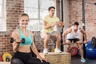 Fit people working out in gym