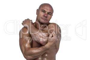 Portrait of bodybuilder stretching with hands