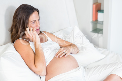 Happy woman having conversation on smartphone