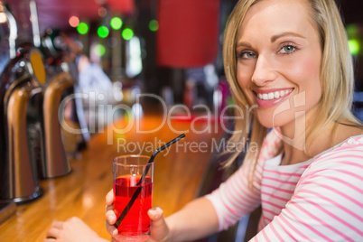 Portrait of happy woman with drink