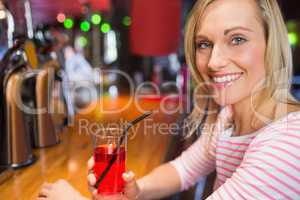Portrait of happy woman with drink