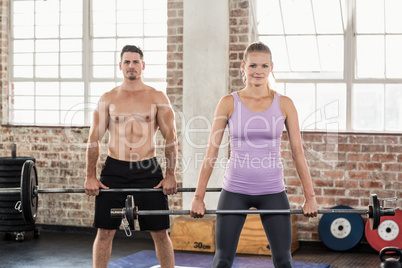 Two fit people working out