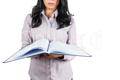 Businesswoman looking at a business ledger