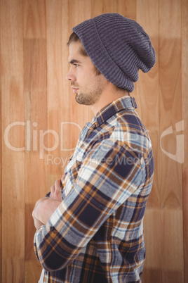 Side view of confident hipster with arms crossed