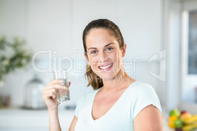 Portrait of happy woman holding water