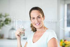 Portrait of happy woman holding water