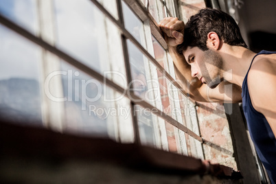 Man looking outside from window